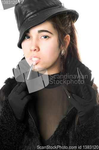 Image of Portrait of pretty young brunette in gloves with claws