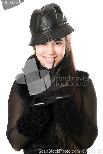 Image of Portrait of smiling young brunette in gloves with claws