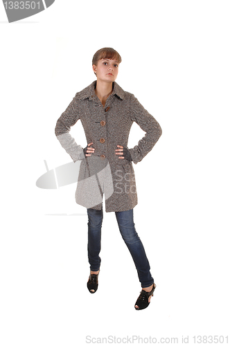 Image of Girl in brown coat.