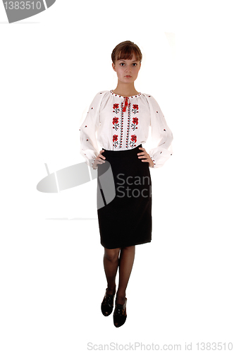 Image of Girl in white blouse and skirt.