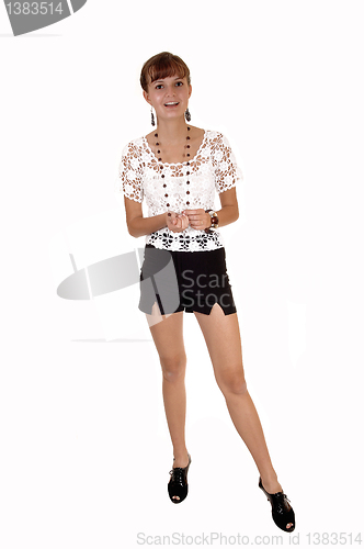 Image of Girl in shorts and blouse.