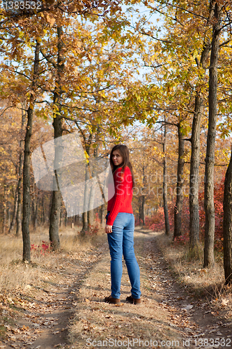 Image of Girl walking in a park