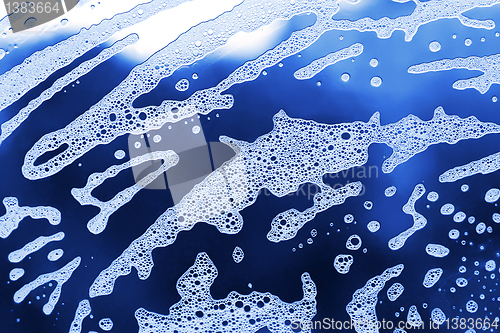 Image of soap foam on the glass