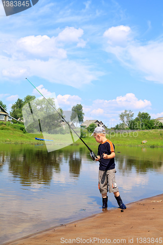 Image of boy fishes on coast river