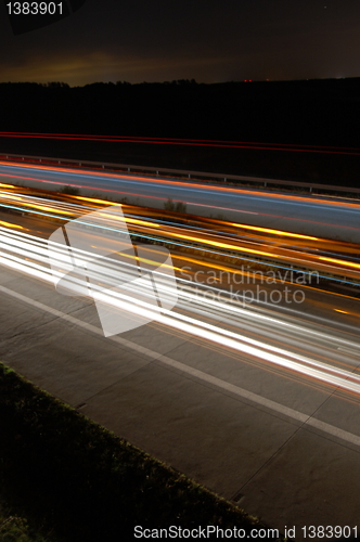 Image of highway at night with traffic