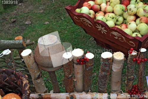 Image of apple in box near old fence