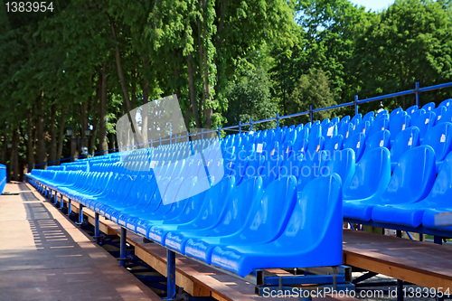 Image of blue easy chairs on stadium