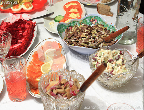 Image of varied food-stuffs on white tablecloth