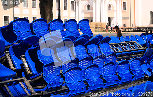 Image of blue easy chairs on stadium