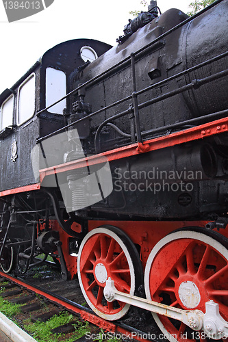 Image of wheel of the old locomotive on stop