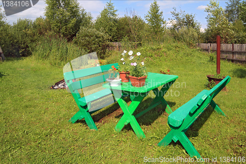 Image of garden furniture in summer garden