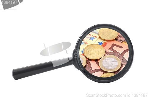 Image of money behind megnifying glass