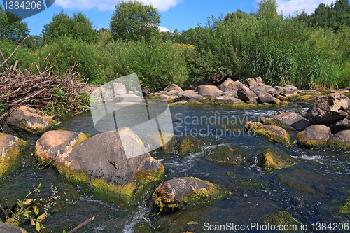 Image of mountain river flow between stone