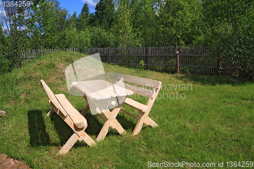 Image of wooden furniture in summer park