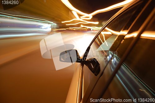 Image of night drive with car in motion 