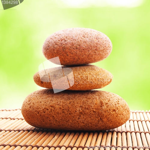 Image of zen stone with leaf