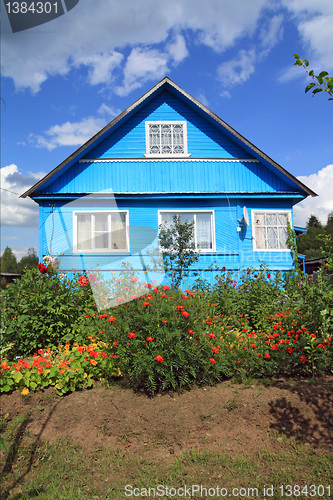 Image of summer flowerses near rural building