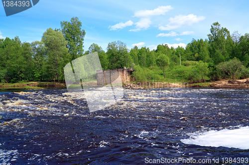 Image of aging destroyed dam on small river