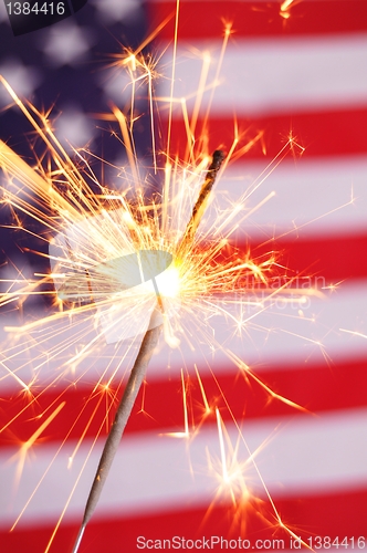 Image of sparkler and usa flag