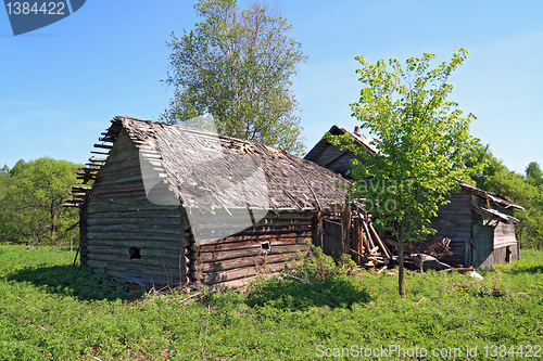 Image of rural house on green field