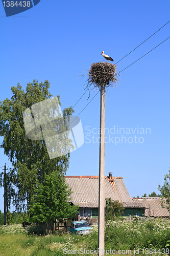 Image of crane on pole amongst villages