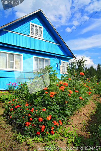 Image of blue rural house on celestial background 