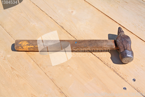 Image of old gavel on wooden board