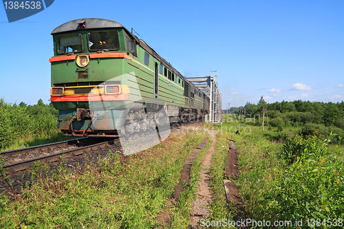 Image of freight train on railway bridge