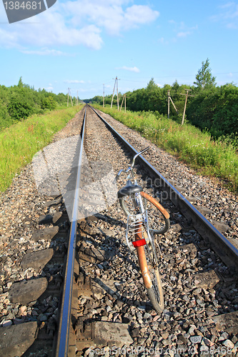 Image of old bicycle on railway