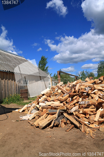 Image of firewood in courtyard of the rural building