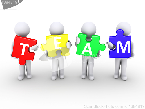 Image of Men holding team puzzle pieces