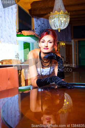 Image of glamour woman in vintage hall interior