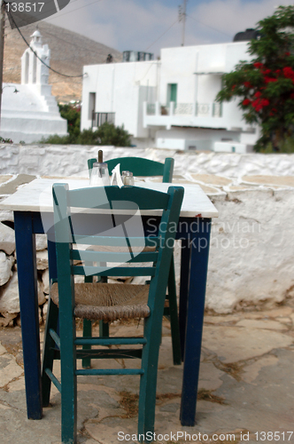 Image of taverna setting with church