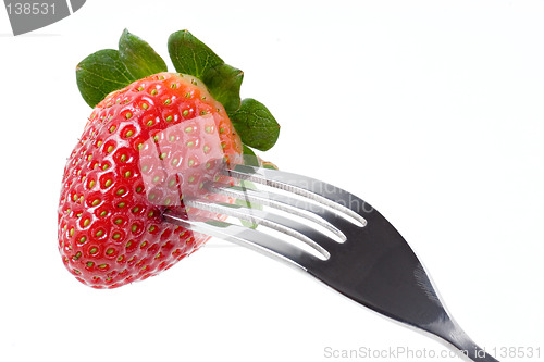 Image of Strawberry with fork isolated on white