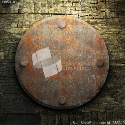Image of rusty metal and wood plate