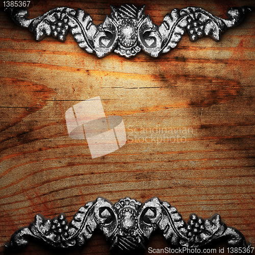 Image of iron ornament on wood