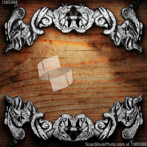 Image of iron ornament on wood