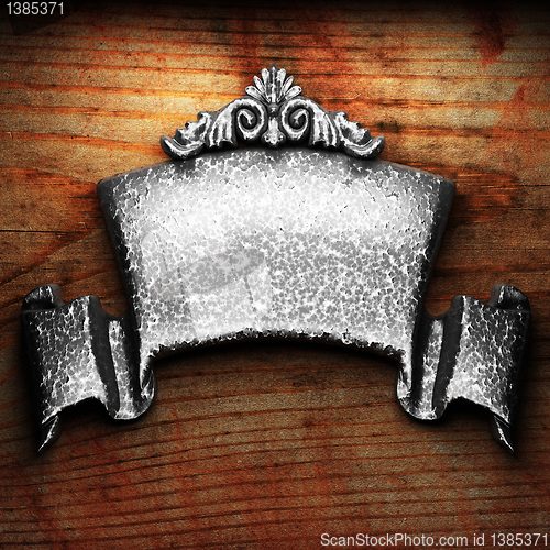 Image of iron ornament on wood