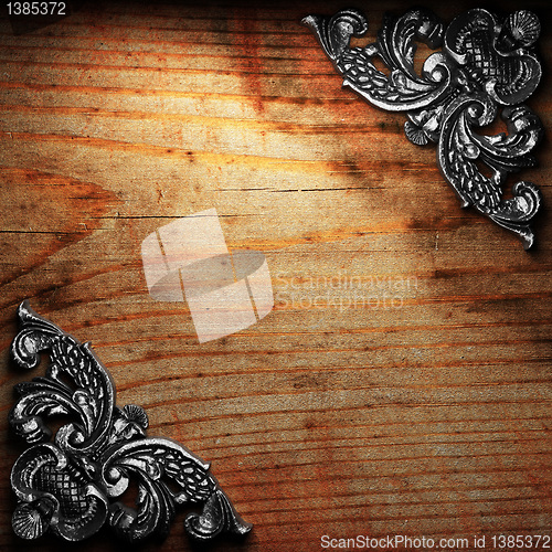 Image of iron ornament on wood