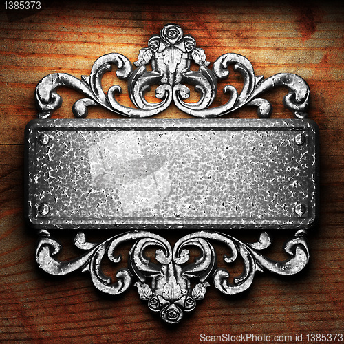 Image of iron ornament on wood