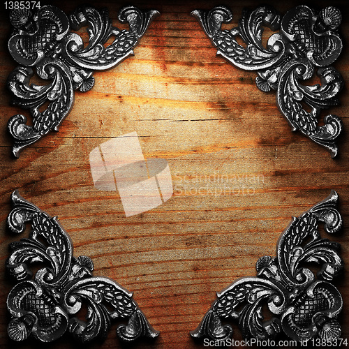 Image of iron ornament on wood