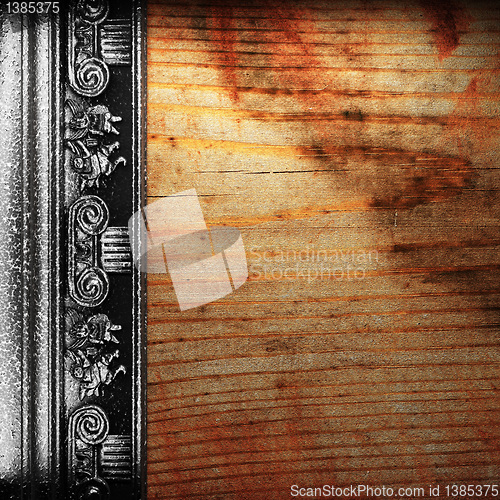 Image of iron ornament on wood