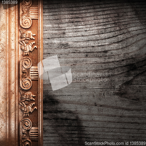 Image of golden ornament on wood