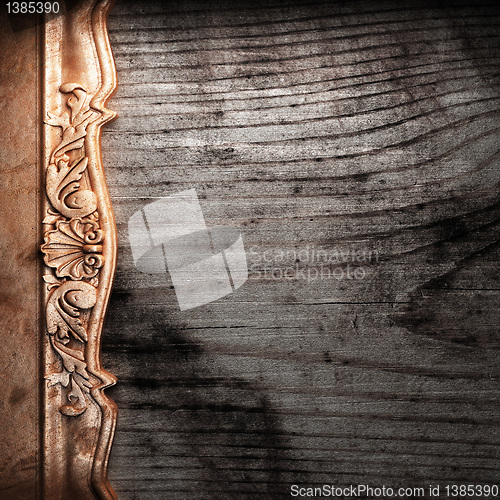 Image of golden ornament on wood