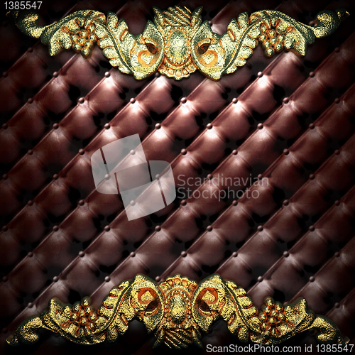 Image of golden ornament on leather