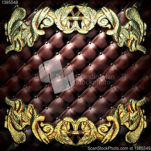 Image of golden ornament on leather