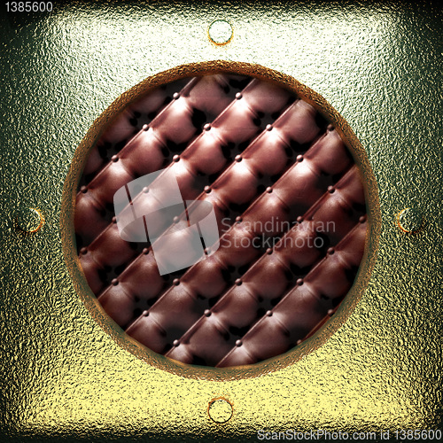 Image of golden plate on leather