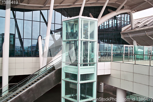 Image of Glass elevator and escalator
