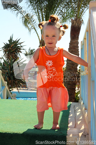 Image of happy little girl outdoor