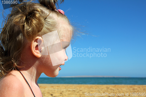 Image of happy little girl on beach